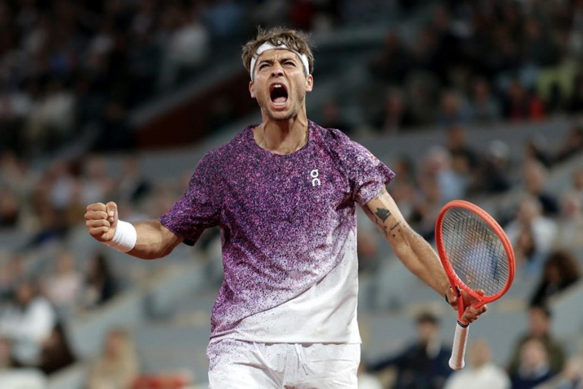 Italy's Flavio Cobolli reacts after a point as he plays against Canada's Felix Auger-Aliassime during their men's quarter final singles match on day 11 of the French Open tennis tournament on Court Philippe-Chatrier at the Roland-Garros Complex in Paris on June 3, 2026. Thomas SAMSON / AFP