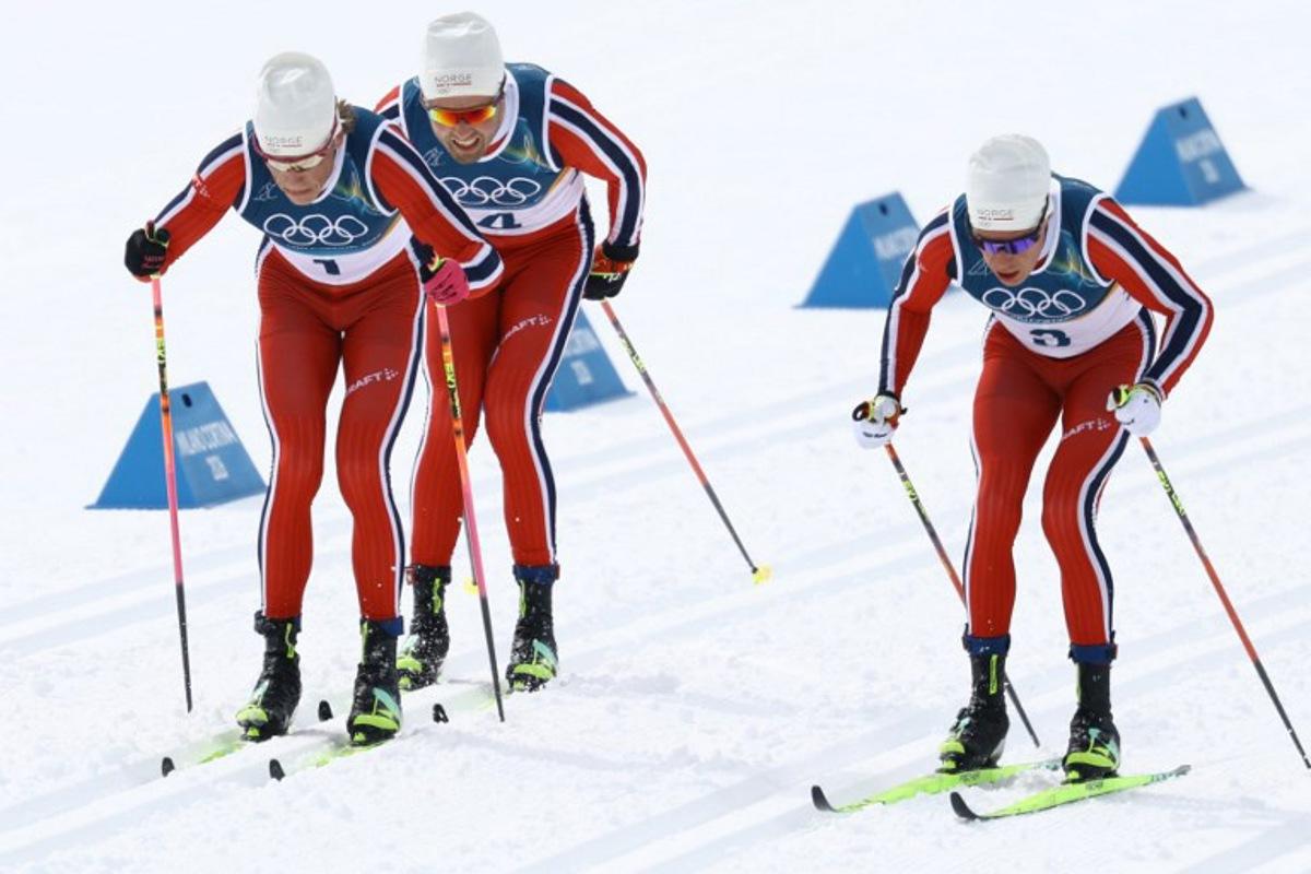 (From L) Norway's Johannes Hoesflot Klaebo, Norway's Emil Iversen and Norway's Martin Loewstroem Nyenget compete during the men's cross country 50km mass start final event of the Milano Cortina 2026 Winter Olympic Games at Tesero Cross-Country Skiing Stadium in Lago di Tesero (Val di Fiemme) on February 21, 2026. Anne-Christine POUJOULAT / AFP