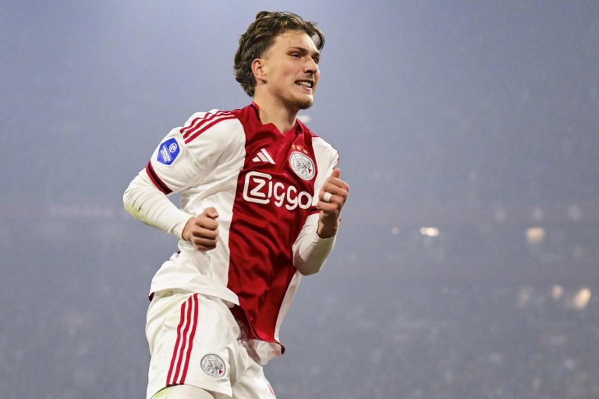 Ajax's Belgian forward #11 Mika Godts celebrates scoring the opening goal during the Dutch Eredivisie first division football match between AFC Ajax and SC Heerenveen at the Johan Cruijff ArenA in Amsterdam on November 1, 2025. Olaf KRAAK / ANP / AFP