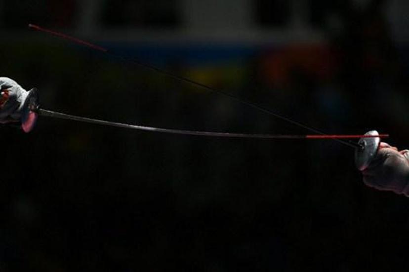 Russia's Timur Safin competes against China's Chen Haiwei during their men¿s individual foil quarter-final bout as part of the fencing event of the Rio 2016 Olympic Games, on August 7, 2016, at the Carioca Arena 3, in Rio de Janeiro.
Kirill KUDRYAVTSEV / AFP