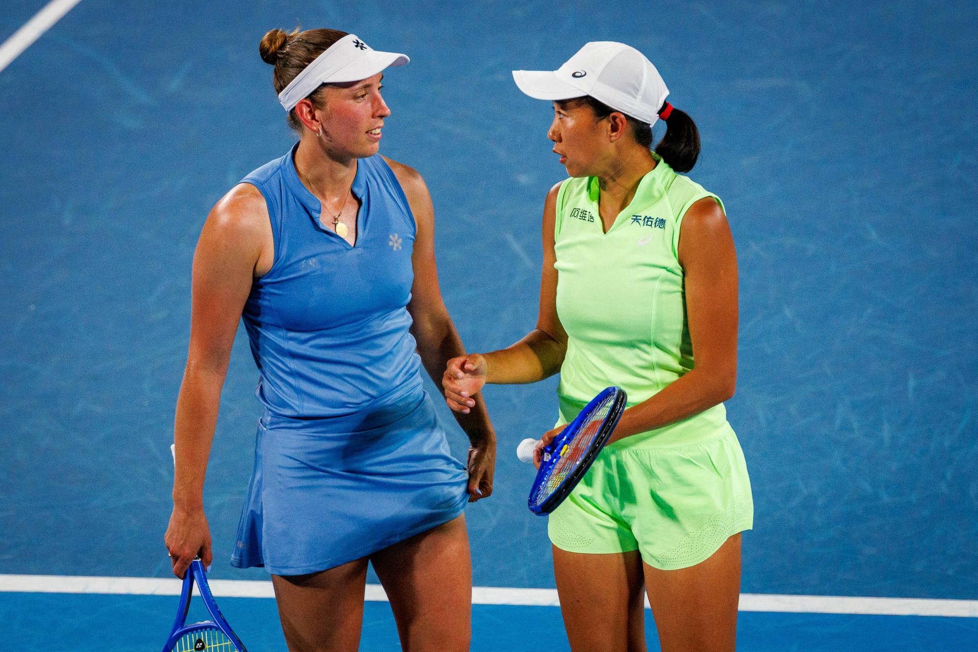 Belgium's Elise Mertens (blue) and Chinese Shuai Zhang (yellow) pictured in action during a tennis match between US pair Baptiste/Stearns and Belgian/ Chinese pair Mertens/Zhang, in the 1/8 final of the women doubles at the Australian Open, in Melbourne Park, Melbourne on Tuesday 27 January 2026. BELGA PHOTO PATRICK HAMILTON --- BENELUX ONLY ---