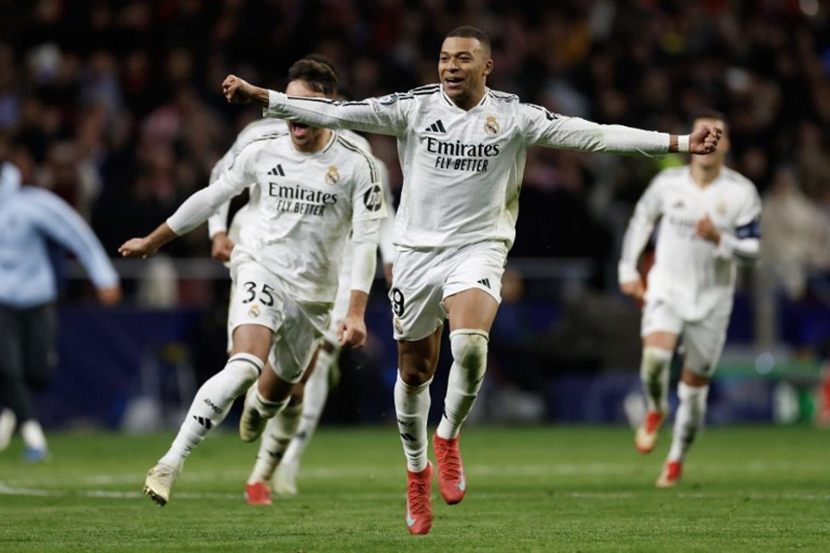 Real Madrid's French forward #09 Kylian Mbappe celebrates during a penalty shootout during the UEFA Champions League Round of 16 second leg football match between Club Atletico de Madrid and Real Madrid CF at the Metropolitano stadium in Madrid on March 12, 2025. Oscar DEL POZO CAÑAS / AFP