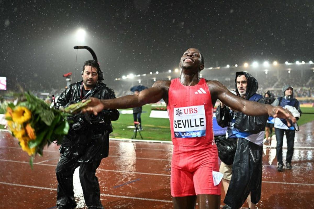 Jamaica's Oblique Seville celebrates after winning the men's 100m event of the IAAF Diamond League athletics meeting "Athletissima" at Stade Olympique de la Pontaise in Lausanne, on August 20, 2025. Fabrice COFFRINI / AFP