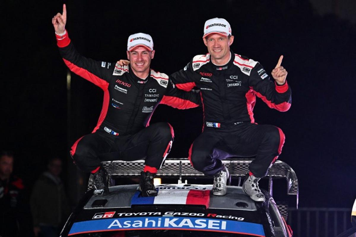 Sebastien Ogier (R) and his co-driver Vincent Landais (L) of France celebrate their victory on their Toyota GR Yaris Rally1 during the podium ceremony of the Rally Japan, the 13th round of the FIA World Rally Championships, in Toyota city, Aichi prefecture on November 9, 2025. Toshifumi KITAMURA / AFP