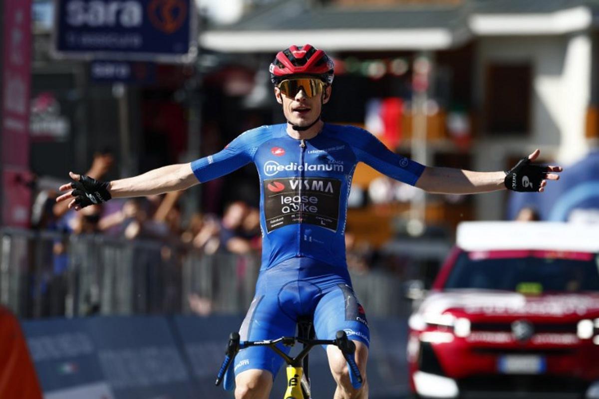 Team Visma Lease a Bike Danish rider Jonas Vingegaard crosses the finish line to win the 14th stage of the Giro d'Italia 2026 - Tour of Italy cycling race between Aosta and Pila (Gressan), Italy, on May 23, 2026. Luca Bettini / AFP