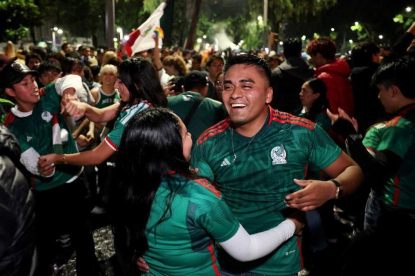Mexican football fans celebrate their victory at the Angel de la Independencia in Mexico City on June 24, 2026, after the 2026 FIFA World Cup football match between Mexico and Czechia. Claudia Rosel / AFP
