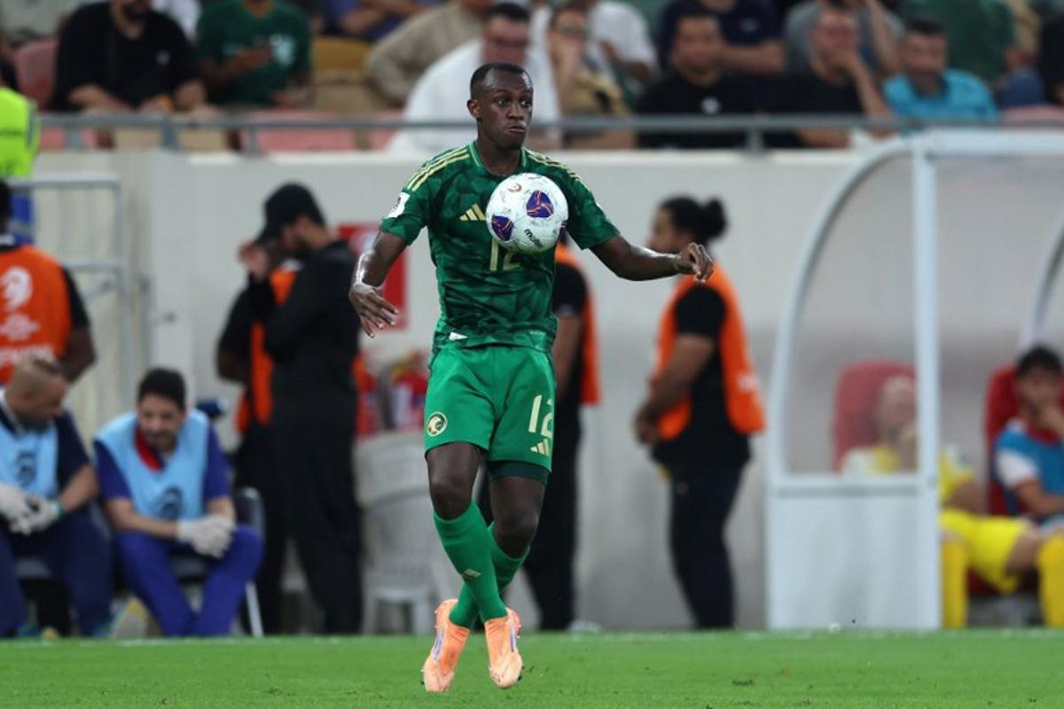 Saudi Arabia's defender #12 Saud Abdulhamid controls the ball during the FIFA World Cup 2026 Asian qualifier football match between Saudi Arabia and Iraq at King Abdullah Sports City in Jeddah on October 14, 2025. AFP