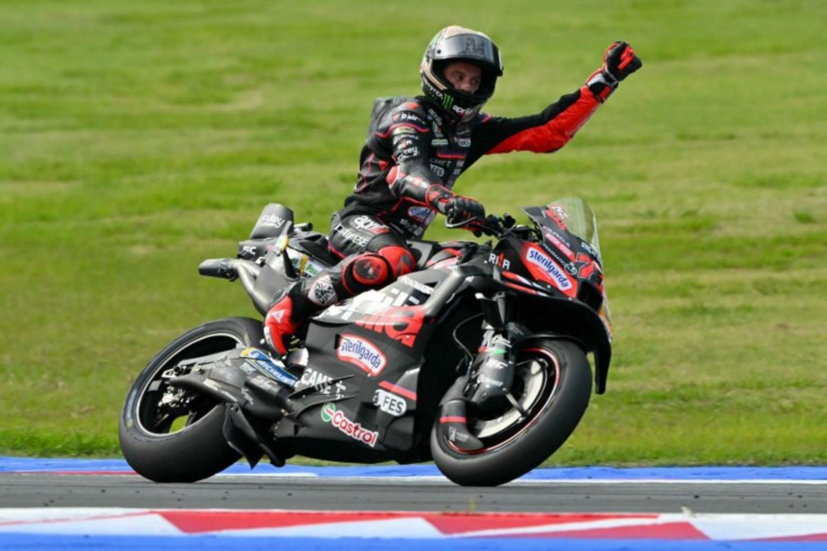 Aprilia Racing team's Italian MotoGP rider Marco Bezzecchi celebrates winning the San Marino Moto GP Sprint Race at the Misano World Circuit Marco Simoncelli, in Misano Adriatico, northern Italy, on September 13, 2025. Andreas SOLARO / AFP