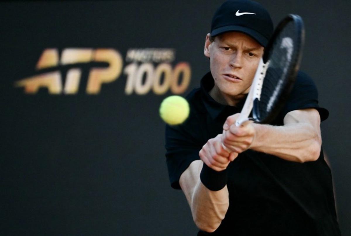 Italy's Jannik Sinner hits a return to Norway's Casper Ruud during the men's final of the ATP Rome Open tennis tournament at Foro Italico in Rome on May 17, 2026. Filippo MONTEFORTE / AFP