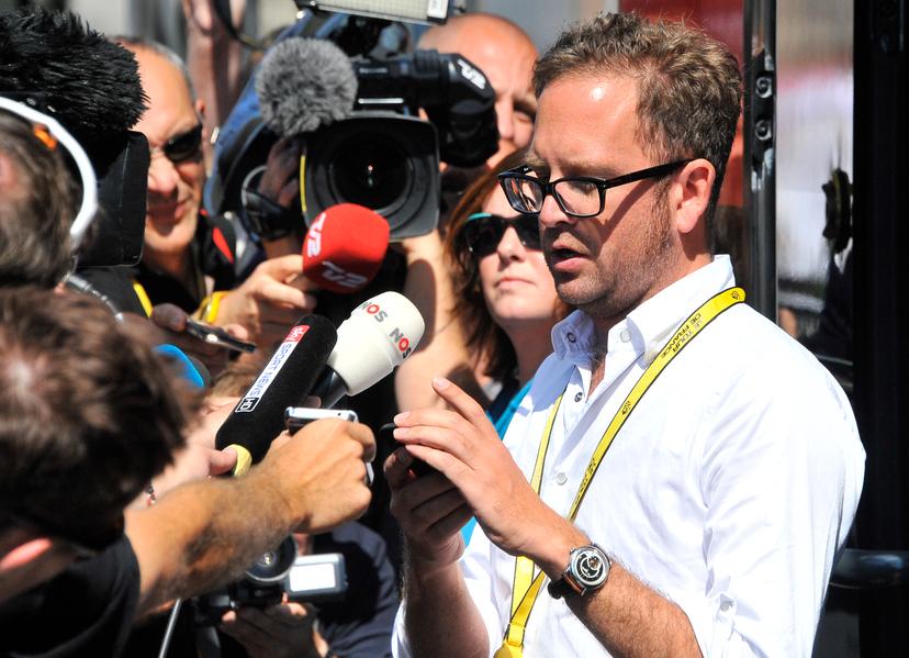 20120705 - SAINT-QUENTIN, FRANCE: Garmin-Sharp procycling sport director Jonathan Vaughters of US reads a press anouncement before the fifth stage of the 99th edition of the Tour de France cycling race, 197km from Rouen to Saint-Quentin, France Thursday 05 July 2012. BELGA PHOTO NICOLAS BOUVY