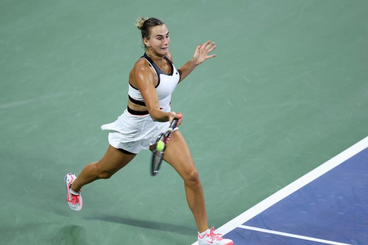 Belarus's Aryna Sabalenka plays a forehand return to Spain's Cristina Bucsa during their women's singles round of 16 tennis match on day eight of the US Open tennis tournament at the USTA Billie Jean King National Tennis Center in New York City, on August 31, 2025. CHARLY TRIBALLEAU / AFP