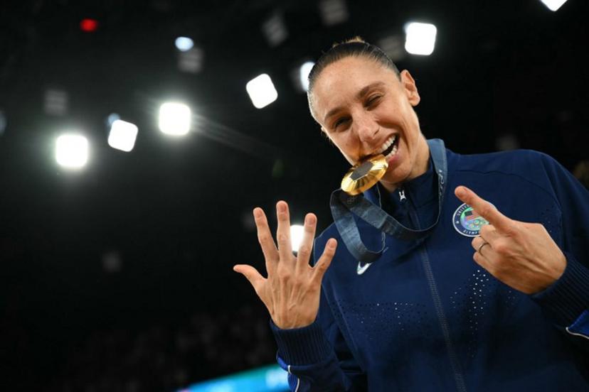 Gold medallists USA's #12 Diana Taurasi poses with her medal after the women's Gold Medal basketball match between France and the USA during the Paris 2024 Olympic Games at the Bercy Arena in Paris on August 11, 2024. Paul ELLIS / AFP