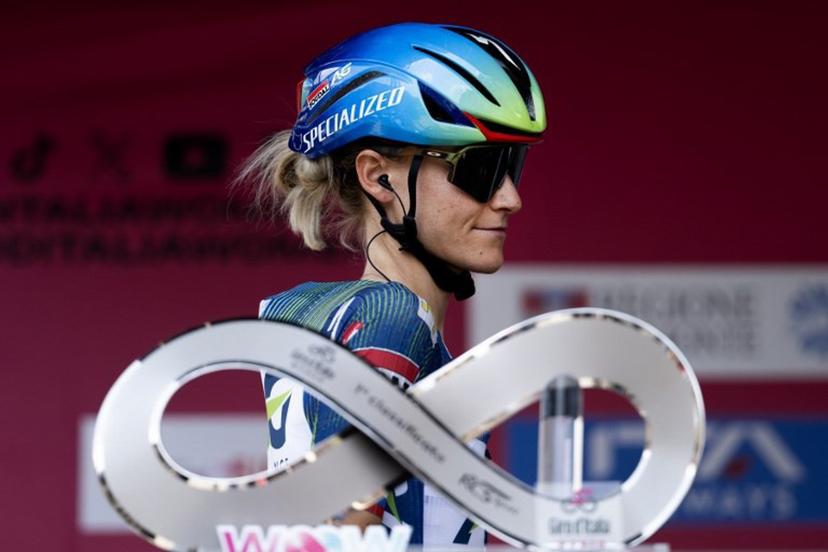 AG Insurance-Soudal's Slovenian cyclist Urska Zigart walks past the Giro d'Italia trophy ("trofeo luce infinita") during the pre-stage presentation ahead of the 9th stage of the Giro d'Italia Women 2026 between Saluzzo and Saluzzo in Saluzzo on June 7, 2026. MARCO BERTORELLO / AFP