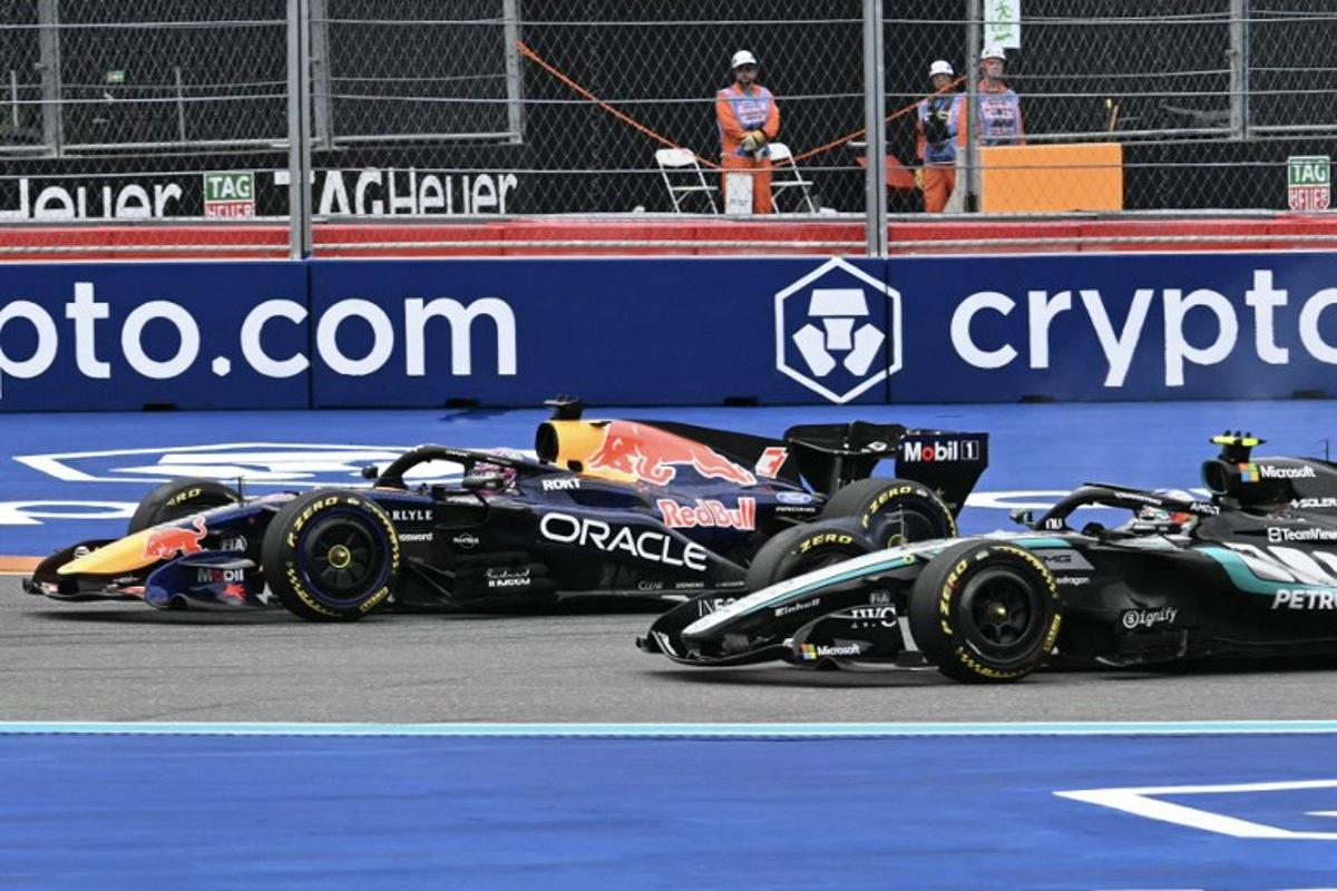 (L/R) Red Bull Racing's Dutch driver Max Verstappen and Mercedes' Italian driver Kimi Antonelli race during the 2026 Miami Formula One Grand Prix at Miami International Autodrome in Miami Gardens, Florida, on May 3, 2026. CHANDAN KHANNA / AFP
