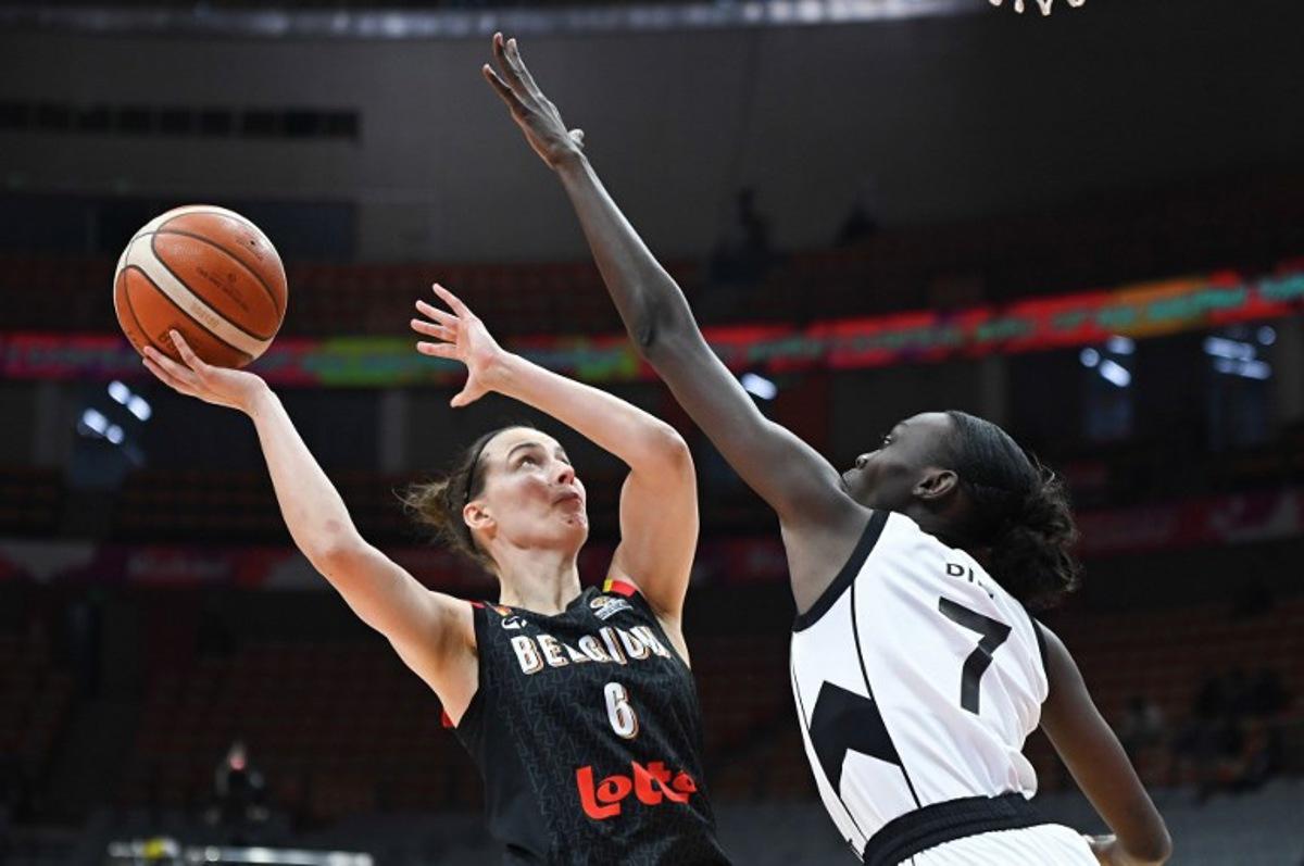 Belgium's Antonia Delaere (L) is blocked by South Sudan's Nyamer Diew during the FIBA Women's Basketball World Cup 2026 qualifying tournament game between Belgium and South Sudan in Wuhan, in China's central Hubei province, on March 15, 2026. CN-STR / AFP