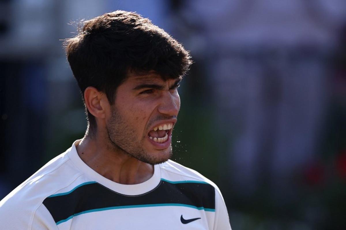 Spain's Carlos Alcaraz celebrates winning against France's Arthur Rinderknech during their men's singles quarter final tennis match at the HSBC ATP tennis Championships at Queen's Club in west London on June 20, 2025. HENRY NICHOLLS / AFP