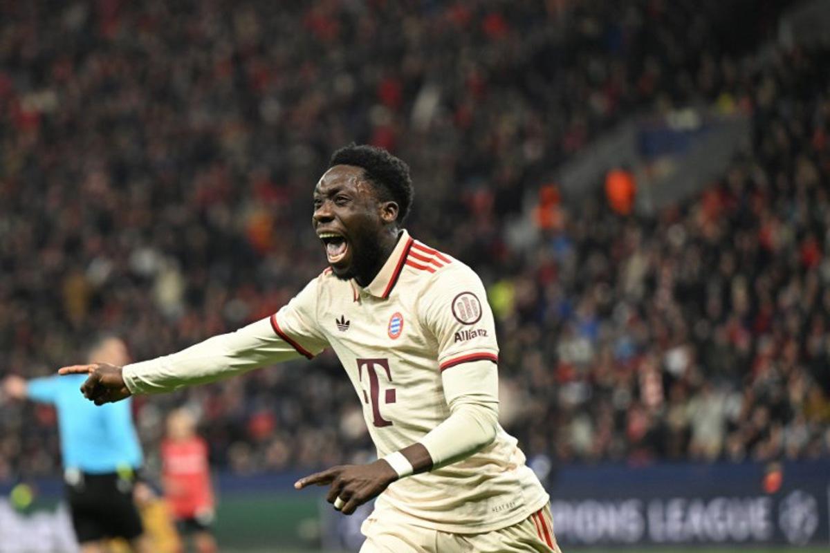 (FILES) Bayern Munich's Canadian defender #19 Alphonso Davies celebrates after scoring the 0-2 goal during the EFA Champions League last 16, second leg, football match between Bayer Leverkusen and Bayern Munich in Leverkusen, western Germany on March 11, 2025. Bayern Munich are facing the prospect of battling for both the league title and the Champions League without key players Dayot Upamecano and Alphonso Davies, who returned from international duty injured, the German giants said on March 26, 2025. INA FASSBENDER / AFP
