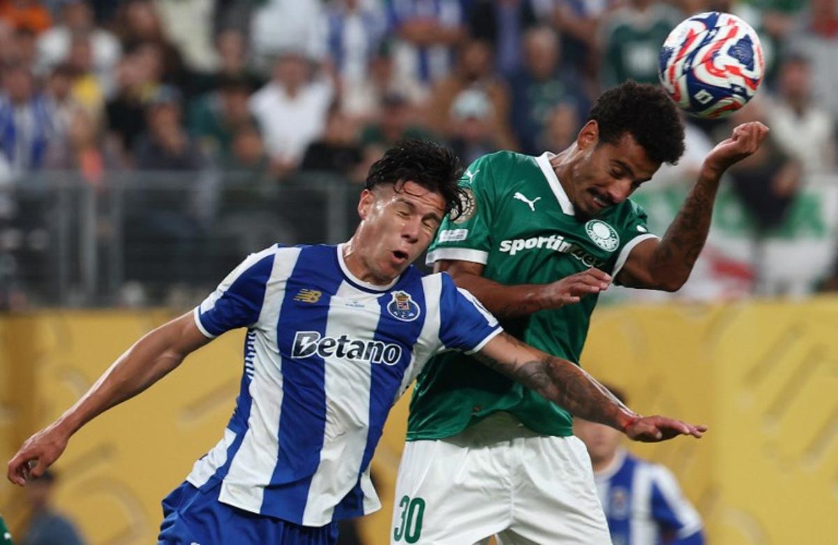 FC Porto's Argentine defender #24 Nehuen Perez and Palmeiras' Brazilian midfielder #30 Lucas Evangelista fight for the ball during the Club World Cup 2025 Group A football match between Brazil's Palmeiras and Portugal's FC Porto at the MetLife stadium East Rutherford, New Jersey on June 15, 2025. FRANCK FIFE / AFP
