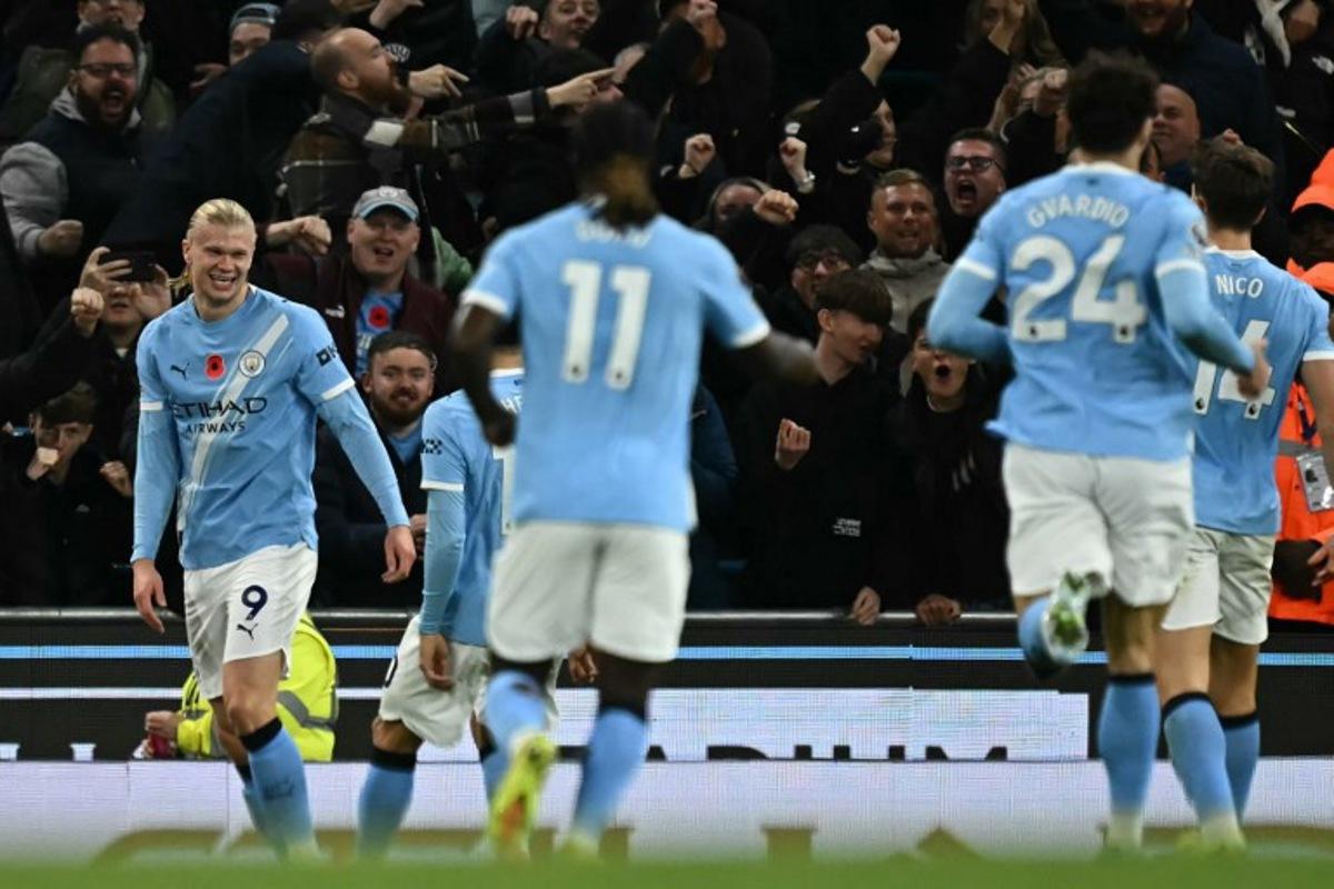 Manchester City's Norwegian striker #09 Erling Haaland (L) celebrates after scoring their second goal during the English Premier League football match between Manchester City and Bournemouth at the Etihad Stadium in Manchester, north west England, on November 2, 2025. Paul ELLIS / AFP