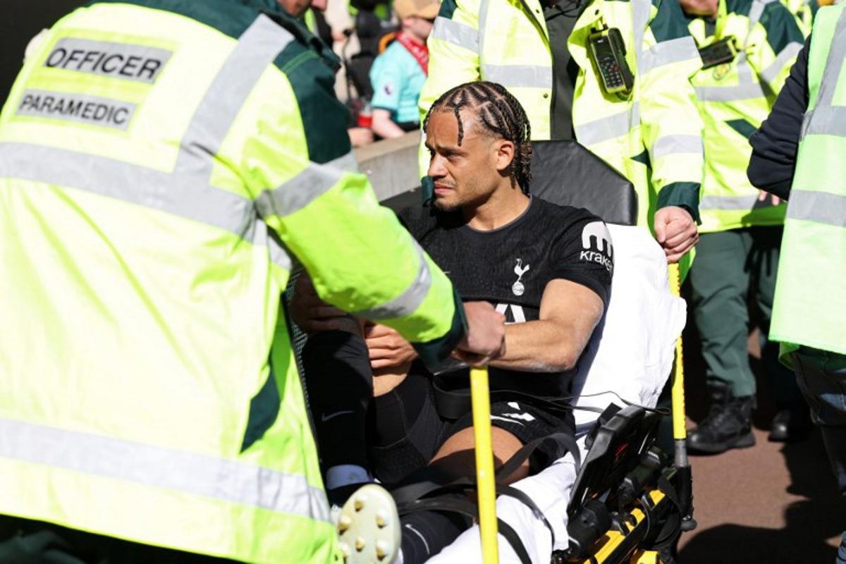 Tottenham Hotspur's Dutch midfielder #07 Xavi Simons is taken off on a stretcher during the English Premier League football match between Wolverhampton Wanderers and Tottenham Hotspur at the Molineux stadium in Wolverhampton, central England on April 25, 2026. Darren Staples / AFP
