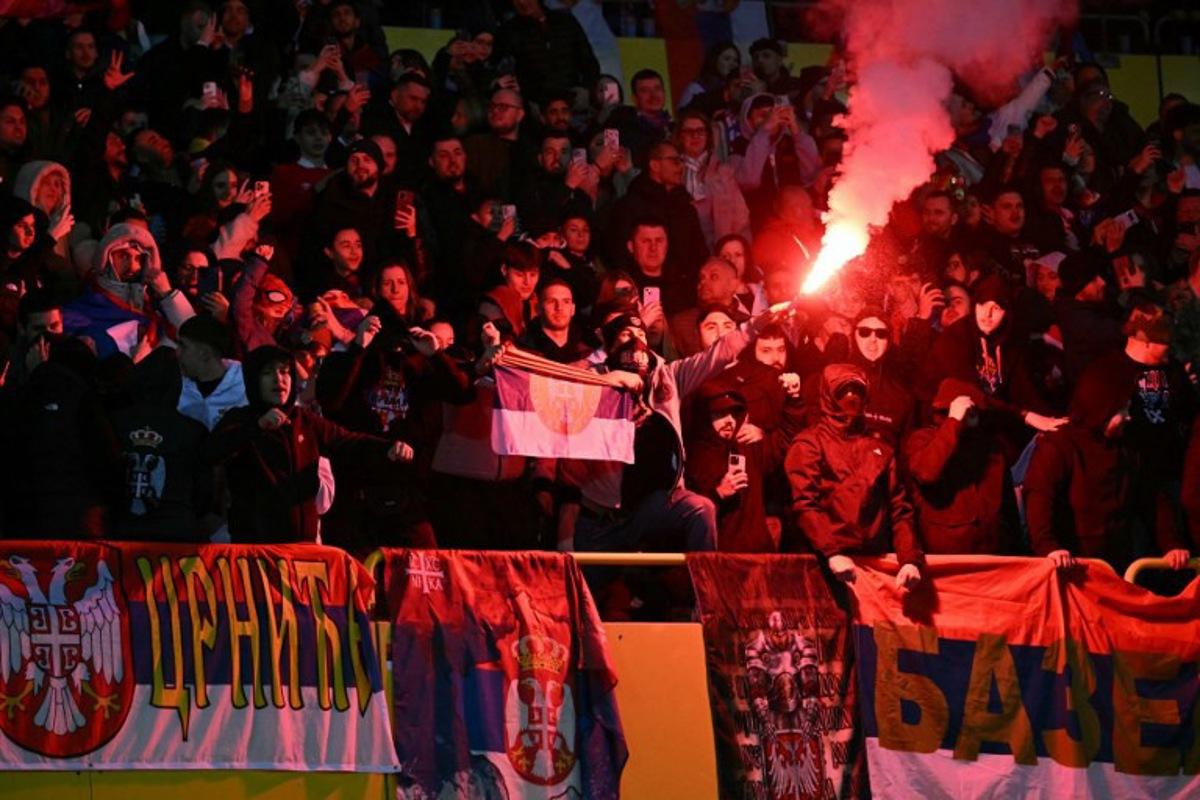 Serbian fans light flares during the UEFA Nations League play-off, first-leg football match Austria v Serbia at the Ernst Happel Stadium in Vienna on March 20, 2025. Joe Klamar / AFP