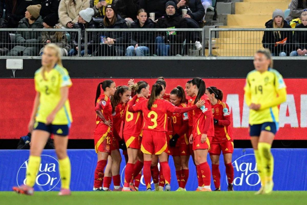 Spain's midfielder #11 Alexia Putellas celebrates scoring the opening goal with her teammates during the UEFA Women's Nations League 2nd-leg semi-final football match between Sweden and Spain at Gamla Ullevi Stadium in Gothenburg, Sweden on October 28, 2025. Bjorn LARSSON ROSVALL / TT NEWS AGENCY / AFP