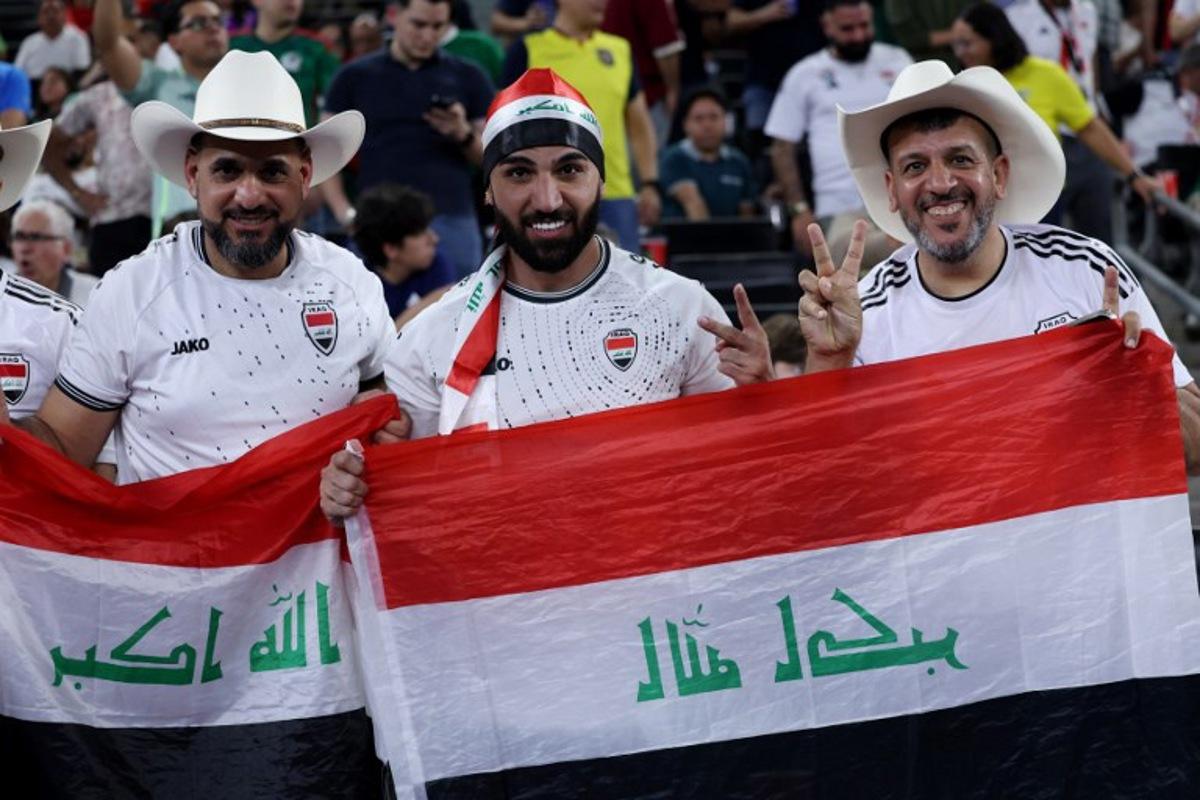 Iraqi fans celebrate after winning the 2026 FIFA World Cup qualifiers final playoff football match between Iraq and Bolivia at the BBVA Stadium in Guadalupe, Nuevo Leon state, Mexico, on March 31, 2026. Julio Cesar AGUILAR / AFP