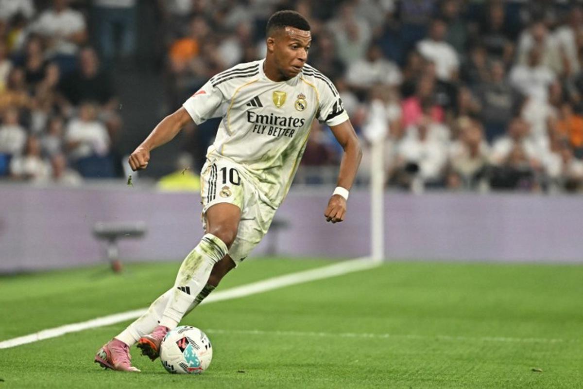 Real Madrid's French forward #10 Kylian Mbappe controls the ball during the Spanish league football match between Real Madrid CF and CA Osasuna at Santiago Bernabeu Stadium in Madrid on August 19, 2025. Javier SORIANO / AFP