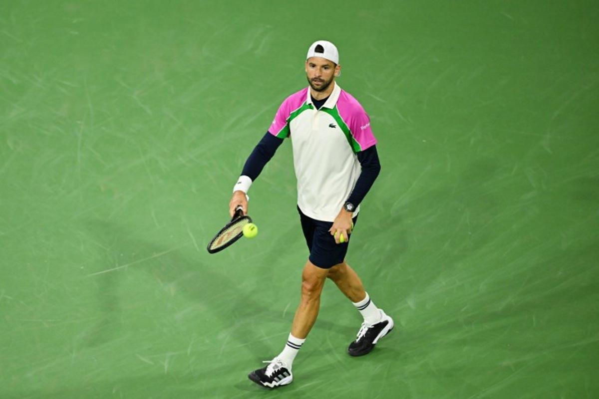 Bulgaria's Grigor Dimitrov reacts during his Round of 16 men's singles tennis match against Spain's Carlos Alcaraz at the BNP Paribas Open at the Indian Wells Tennis Garden in Indian Wells, California, on March 12, 2025. Patrick T. Fallon / AFP