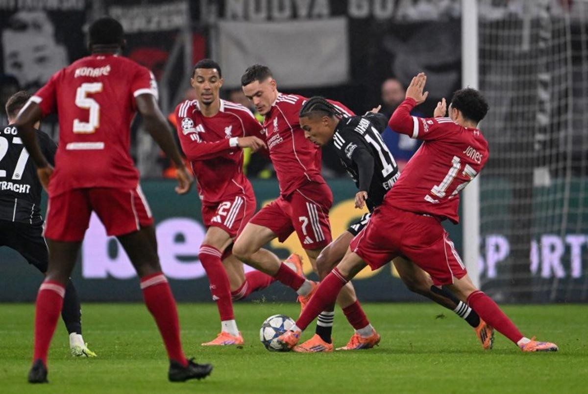 (R-l) Liverpool's English midfielder #17 Curtis Jones, Frankfurt's French forward #19 Jean-Matteo Bahoya, Liverpool's German midfielder #07 Florian Wirtz and Liverpool's French striker #22 Hugo Ekitike vie for the ball during the UEFA Champions League football match between Eintracht Frankfurt and Liverpool FC in Frankfurt, western Germany on October 22, 2025. Kirill KUDRYAVTSEV / AFP
