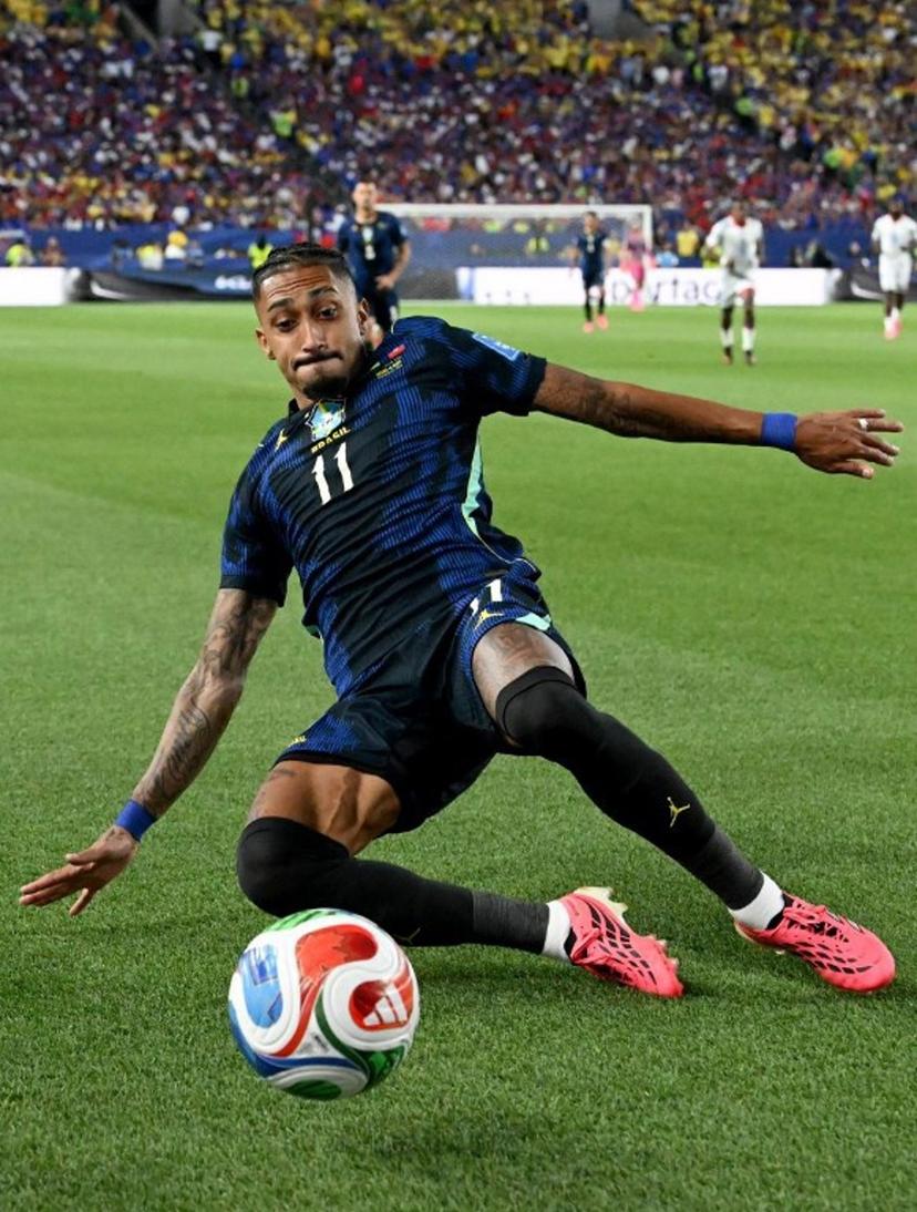 Brazil's forward #11 Raphinha slides for the ball during the 2026 World Cup Group C football match between Brazil and Haiti at the Philadelphia Stadium in Philadelphia on June 19, 2026. ROBERTO SCHMIDT / AFP