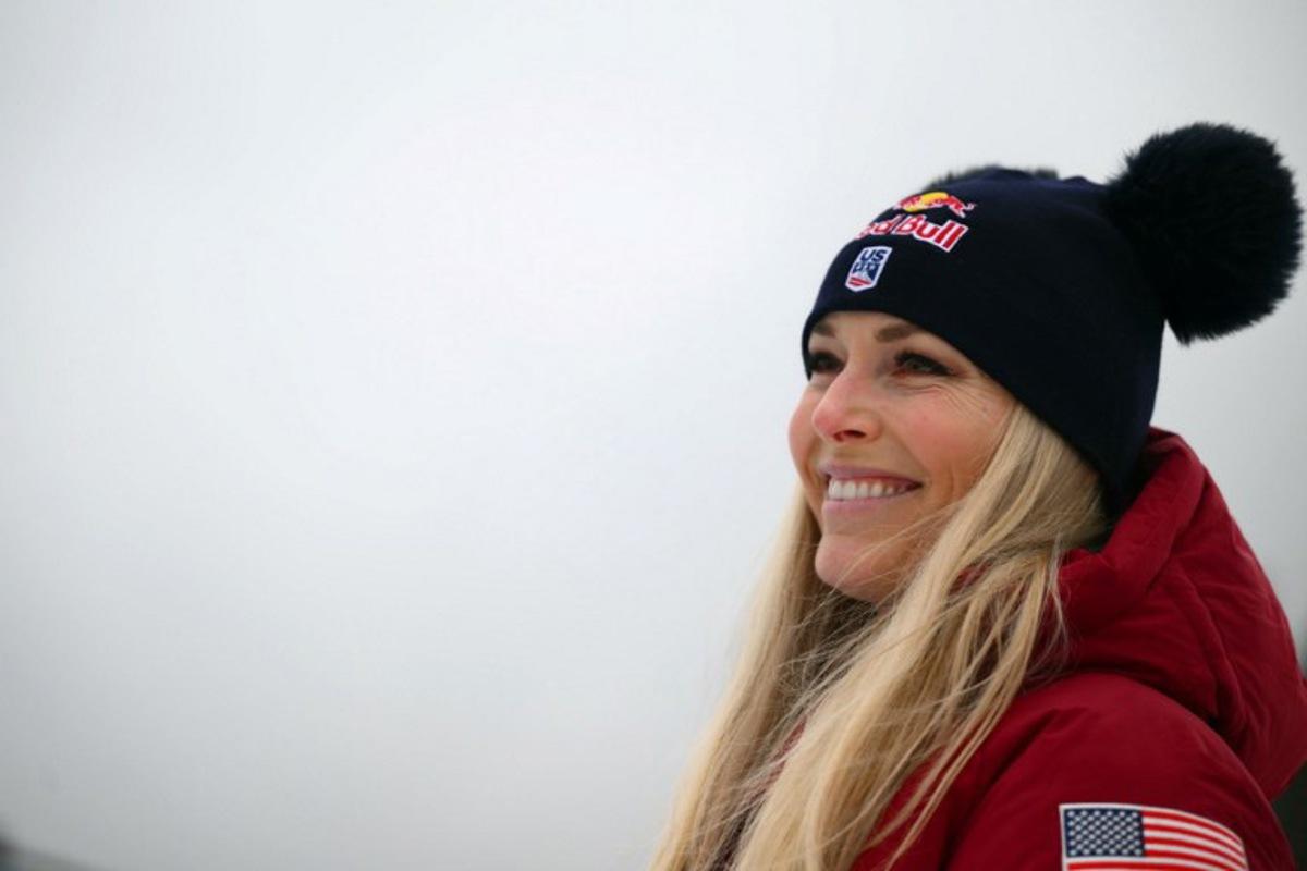 (FILES) US' Lindsey Vonn, second, smiles after the podium ceremony of the Women's Super G event of FIS Alpine Skiing World Cup in Tarvisio, Italy on January 18, 2026. US ski star Lindsey Vonn has defied age and injury to make one of the most remarkable comebacks in Olympic history, the latest chapter in a storied career of memorable highs and crushing setbacks. Vonn will be 41 when she takes to the slope of Cortina d'Ampezzo next month for her fifth Olympics. She retired after the 2019 world championships in Are but made what she dubbed a "crazy" comeback last winter. Marco BERTORELLO / AFP