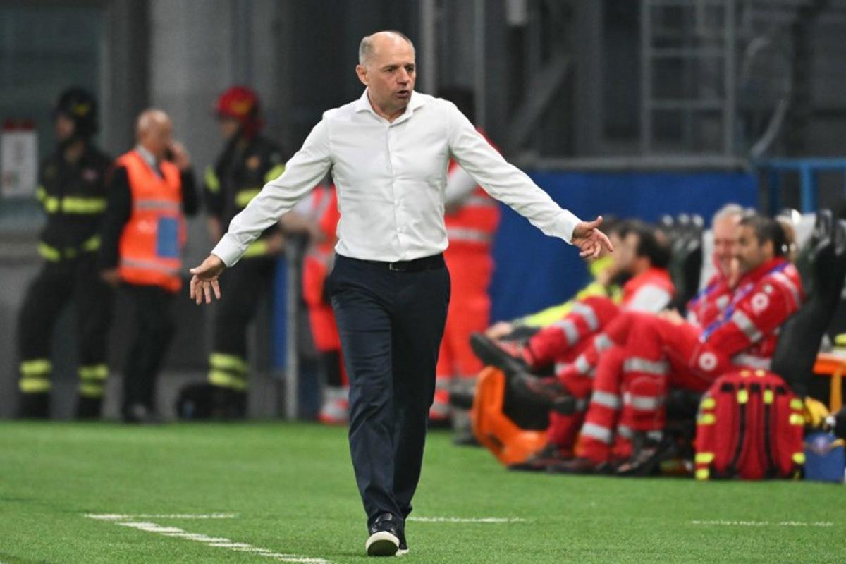 Moldova's coach Serghei Clescenco reacts during the 2026 World Cup qualifiers Europe zone group I football match between Italy and Moldova at the Mapei Stadium in Reggio Emilia, on June 9, 2025. Alberto PIZZOLI / AFP