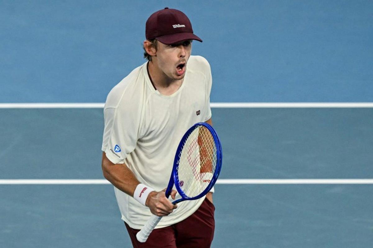 Australia's Alex De Minaur reacts after a point against USA's Frances Tiafoe during their men's singles match on day six of the Australian Open tennis tournament in Melbourne on January 23, 2026. WILLIAM WEST / AFP