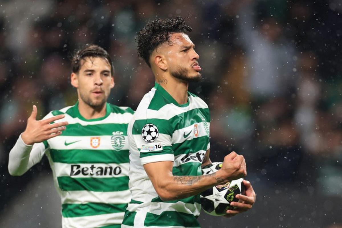 Sporting Lisbon's Colombian forward #97 Luis Suarez (R) celebrates scoring his team's third goal with Sporting Lisbon's Portuguese midfielder #23 Daniel Braganca during the UEFA Champions League last 16 second leg football match between Sporting CP and Bodoe/Glimt at Jose Alvalade stadium in Lisbon on March 17, 2026. PATRICIA DE MELO MOREIRA / AFP