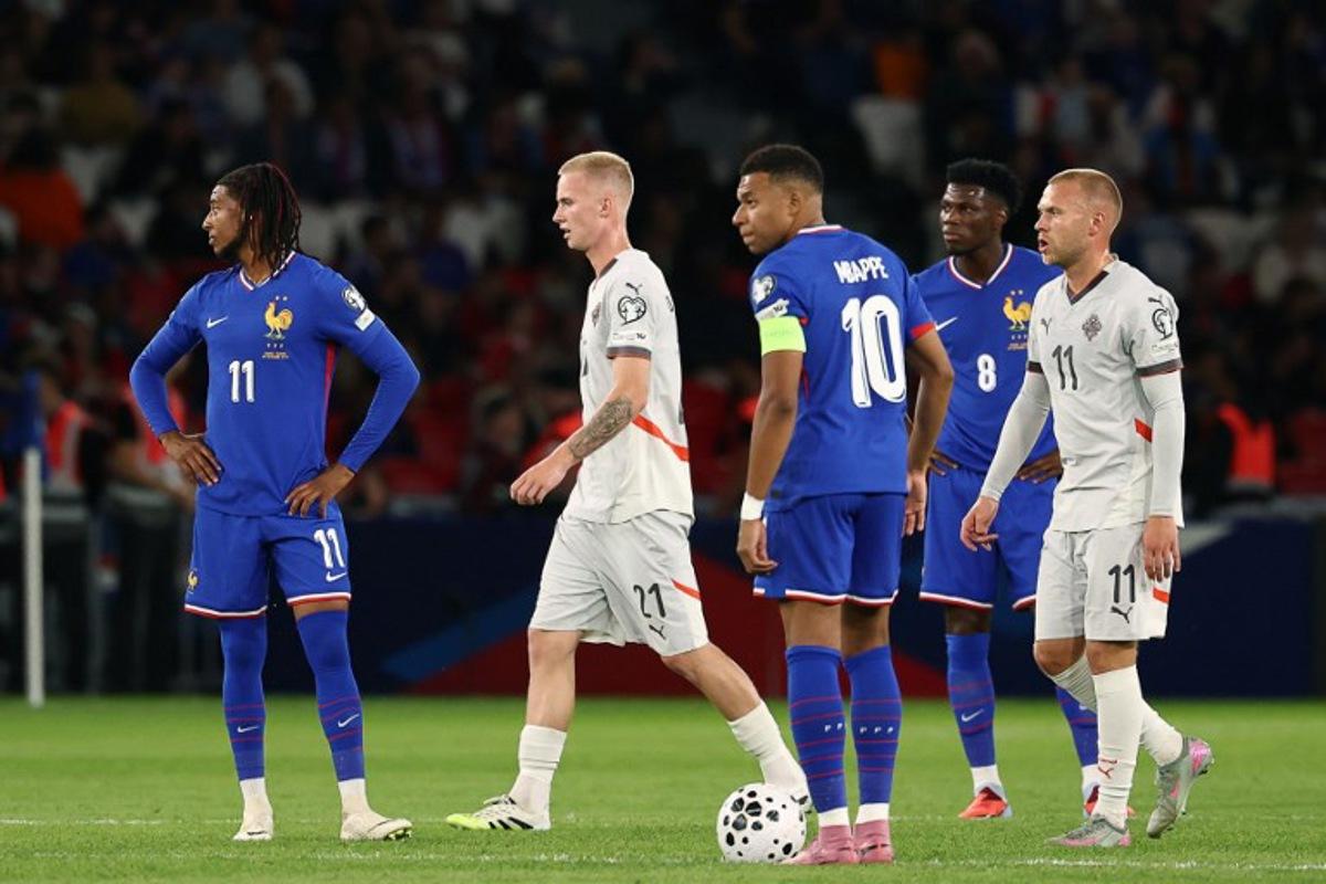 Iceland's forward #21 Daniel Gudjohnsen (2nd L) and Iceland's midfielder #11 Jon Dagur Thorsteinsson (R) reacts next to France's forward #11 Michael Olise (L), France's forward #10 Kylian Mbappe (C) and France's midfielder #08 Aurelien Tchouameni (2nd R) after Iceland scored the opening goal during the FIFA World Cup 2026 Group D European qualification football match between France and Iceland at the Parc des Princes stadium in Paris, on September 9, 2025. FRANCK FIFE / AFP