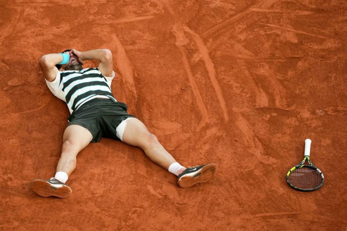 Spain's Carlos Alcaraz celebrates after winning the men's singles final match against Italy's Jannik Sinner on day 15 of the French Open tennis tournament on Court Philippe-Chatrier at the Roland-Garros Complex in Paris on June 8, 2025. Dimitar DILKOFF / AFP