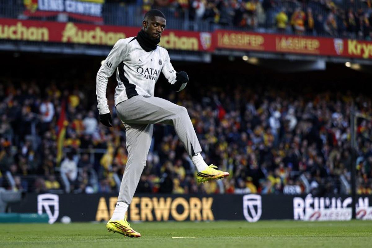 PSG's French forward #10 Ousmane Dembele takes part in the warm-up ahead of the French L1 football match between RC Lens and Paris Saint-Germain (PSG) at the Stade Bollaert-Delelis stadium in Lens on May 13, 2026. SIMON WOHLFAHRT / AFP