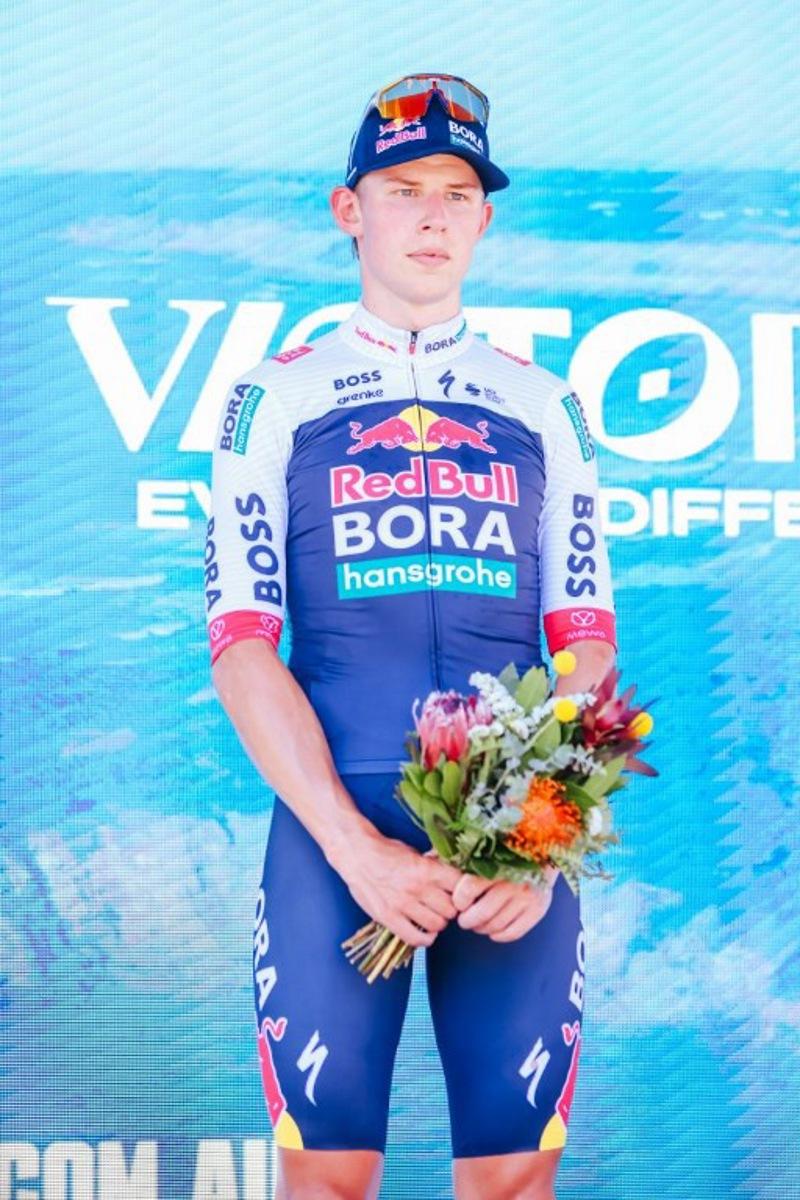 Third-placed New Zealand's Laurence Pithie of Team Red Bull-BORA-Hansgrohe stands on the podium after the men's elite cycling event of the 2025 Cadel Evans Great Ocean Road Race in Geelong on February 2, 2025. CHRIS PUTNAM / AFP