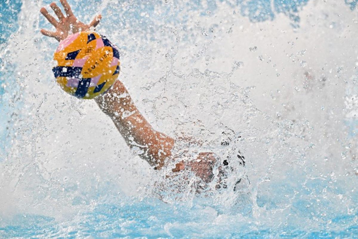 Hungary's #08 Gergo Zalanki vies for the ball in the men's water polo preliminary round group B match between Spain and Hungary during the Paris 2024 Olympic Games at the Aquatics Centre in Saint-Denis, north of Paris, on July 30, 2024. Andreas SOLARO / AFP