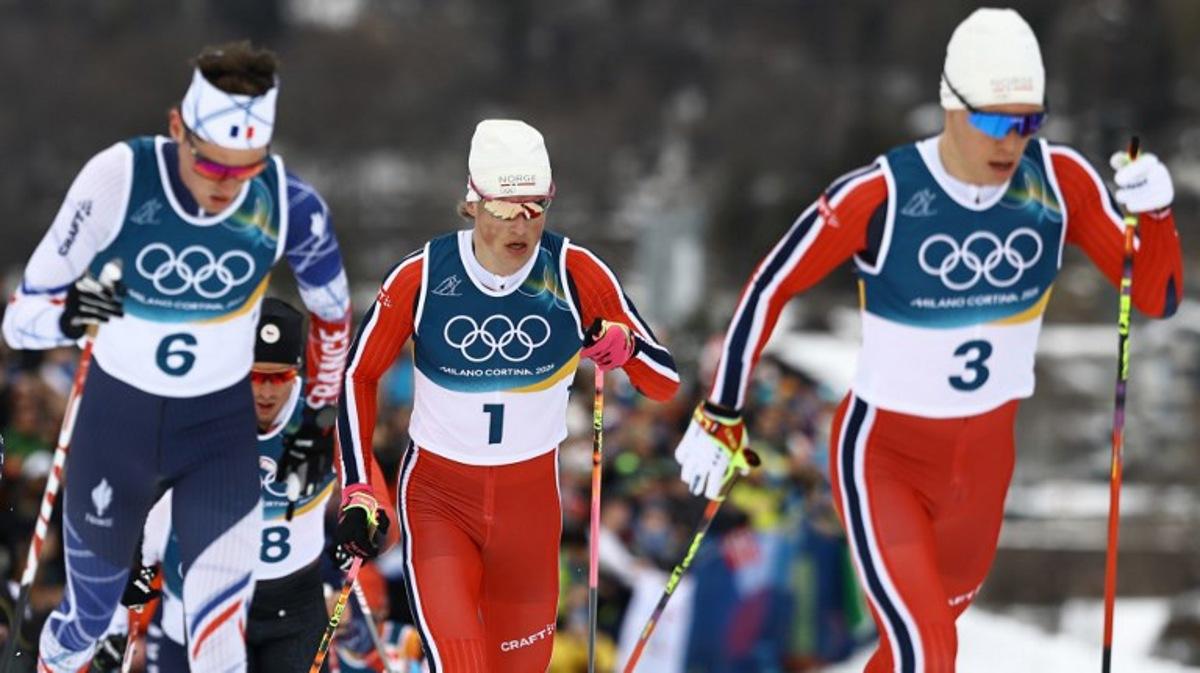 (From L) France's Mathis Desloges, Norway's Johannes Hoesflot Klaebo and Norway's Martin Loewstroem Nyenget compete during the men's cross country 50km mass start final event of the Milano Cortina 2026 Winter Olympic Games at Tesero Cross-Country Skiing Stadium in Lago di Tesero (Val di Fiemme) on February 21, 2026. Anne-Christine POUJOULAT / AFP