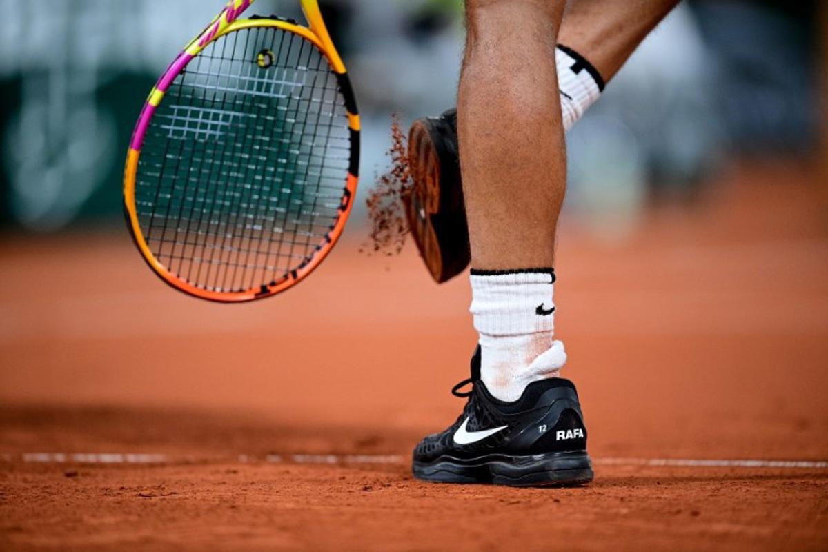 View of the shoes of Spain's Rafael Nadal as he plays against Italy's Jannik Sinner during their men's singles quarter-final tennis match on Day 10 of The Roland Garros 2020 French Open tennis tournament in Paris on October 6, 2020. MARTIN BUREAU / AFP