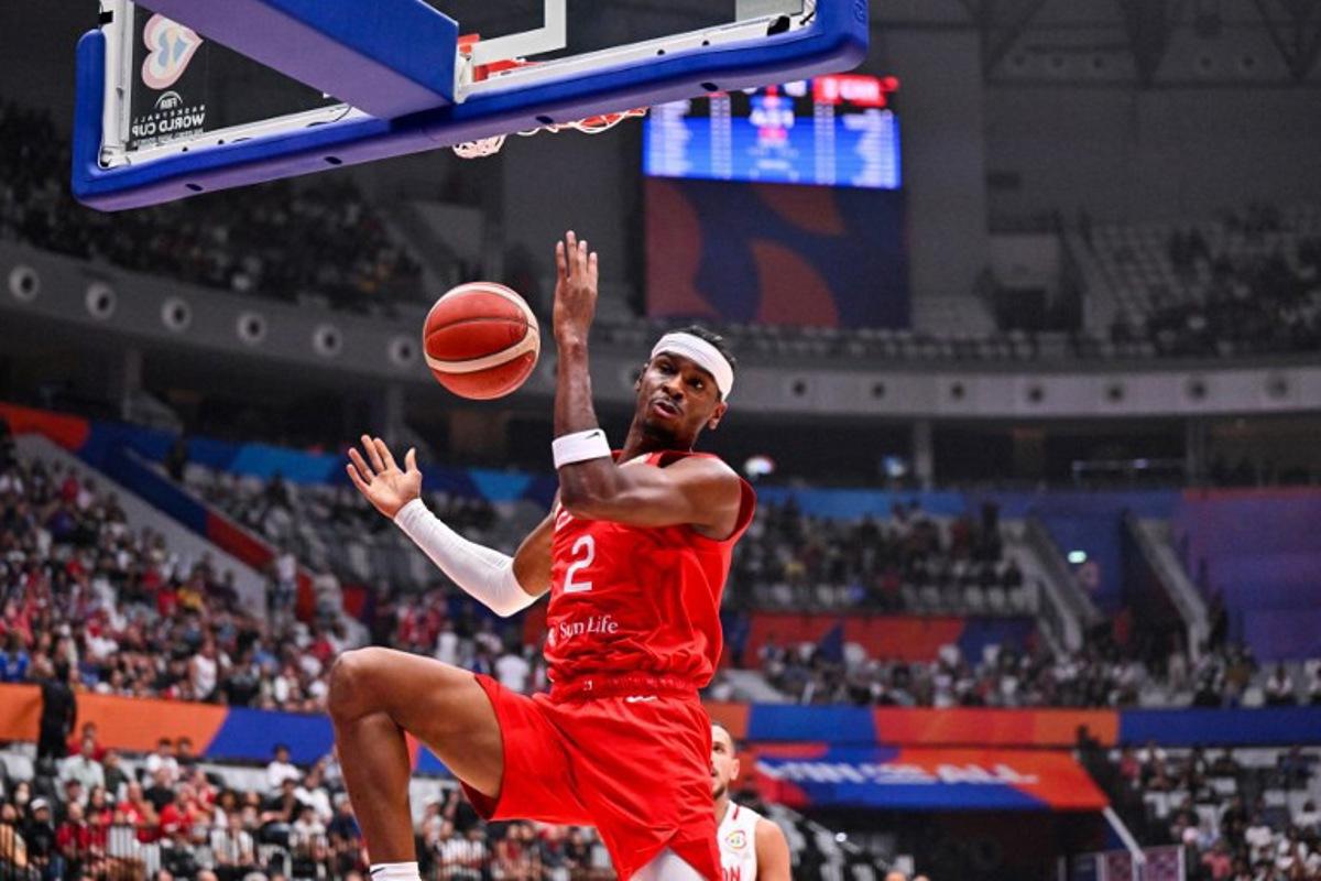 Shai Gilgeous-Alexander of Canada shoots during the FIBA Basketball World Cup group H between Canada and Lebanon at Indonesia Arena in Jakarta on August 27, 2023. ADEK BERRY / AFP
