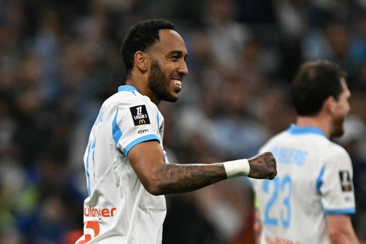 Marseille's Gabonese forward #17 Pierre-Emerick Aubameyang celebrates scoring his team's third goal during the French L1 football match between Olympique de Marseille (OM) and Stade Rennais FC at the Stade Velodrome in Marseille, southern France, on May 17, 2026. Gabriel BOUYS / AFP
