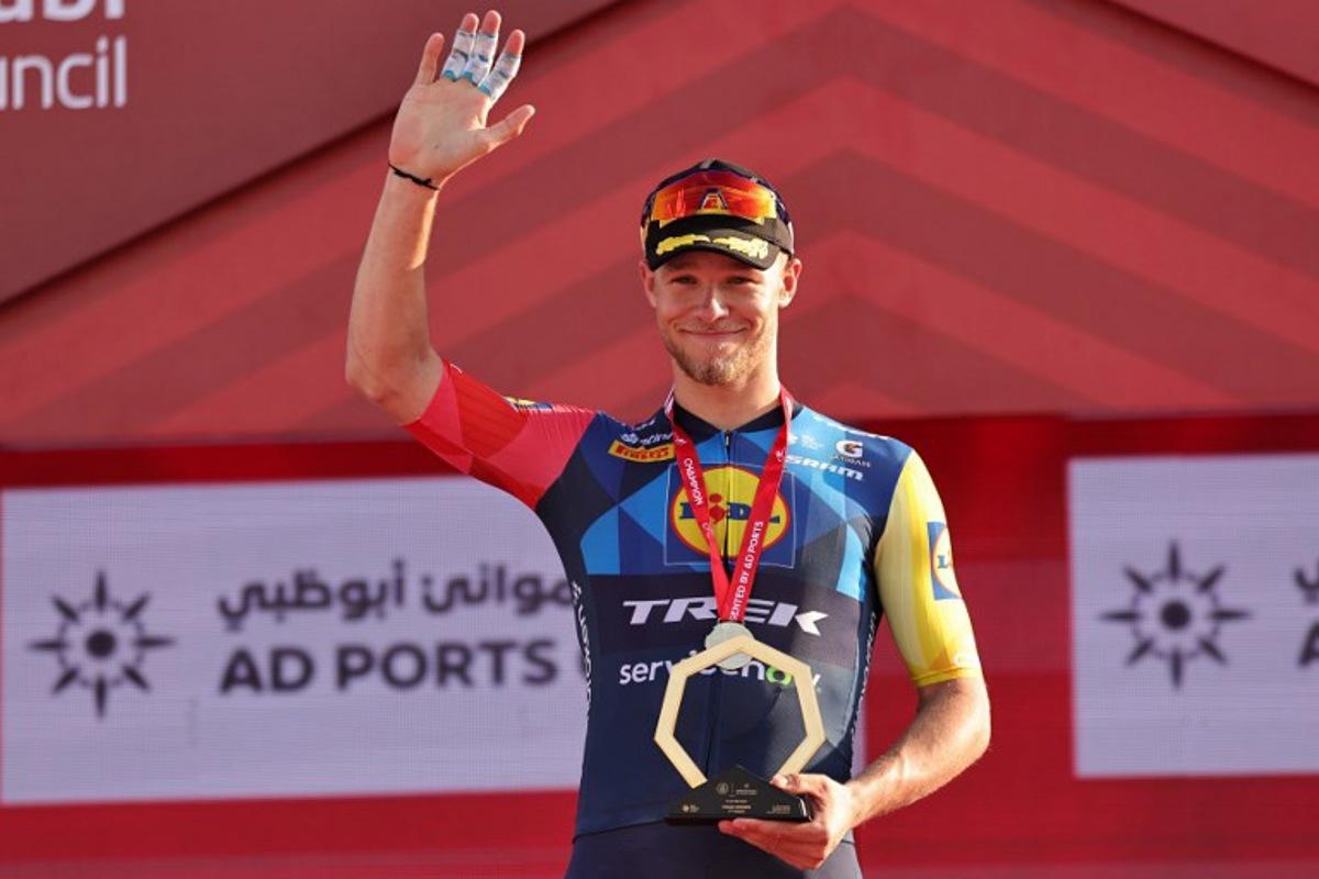 Lidl-Trek's Italian rider Jonathan Milan celebrates on the podium after finishing first in the seventh and final stage of the UAE Tour cycling event from Zayed National Museum to Abu Dhabi Breakwater in Abu Dhabi on February 22, 2026. Fadel SENNA / AFP
