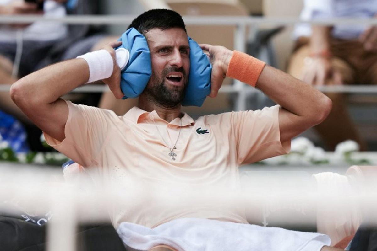 Serbia's Novak Djokovic reacts while sitting in between games as he plays against Brazil's Joao Fonseca during their men's singles match on day 6 of the French Open tennis tournament on Court Philippe-Chatrier at the Roland-Garros Complex in Paris on May 29, 2026. Dimitar DILKOFF / AFP