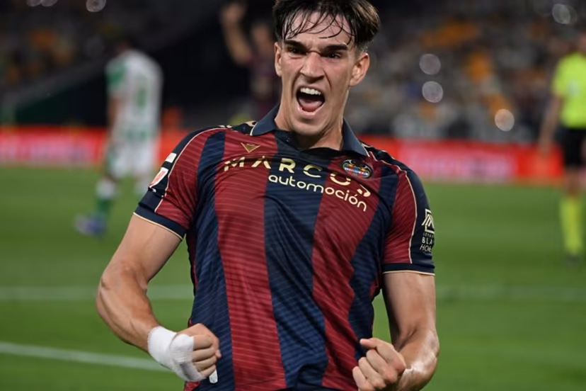 Levante's Spanish forward #19 Carlos Espi Escrihuela celebrates scoring his team's first goal during the Spanish league football match between Real Betis and Levante UD at Benito Villamarin Stadium in Seville on May 23, 2026. CRISTINA QUICLER / AFP