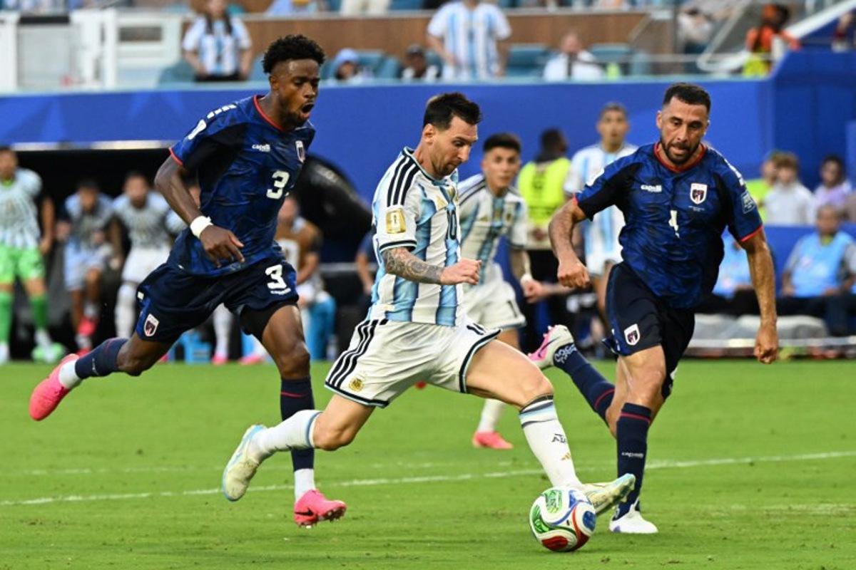 Cape Verde's defender #03 Diney Borges, Argentina's forward #10 Lionel Messi and Cape Verde's defender #04 Pico Lopes fight for the ball during the 2026 World Cup round of 32 football match between Argentina and Cape Verde at the Miami Stadium in Miami Gardens on July 3, 2026. ROBERTO SCHMIDT / AFP
