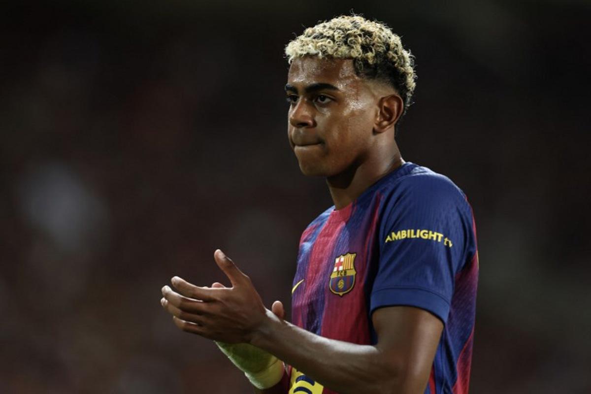 Barcelona's Spanish forward #10 Lamine Yamal reacts during the UEFA Champions League league phase day 2 football match between FC Barcelona and Paris Saint-Germain (PSG) at the Estadi Olimpic Lluis Companys in Barcelona, on October 1, 2025. Josep LAGO / AFP