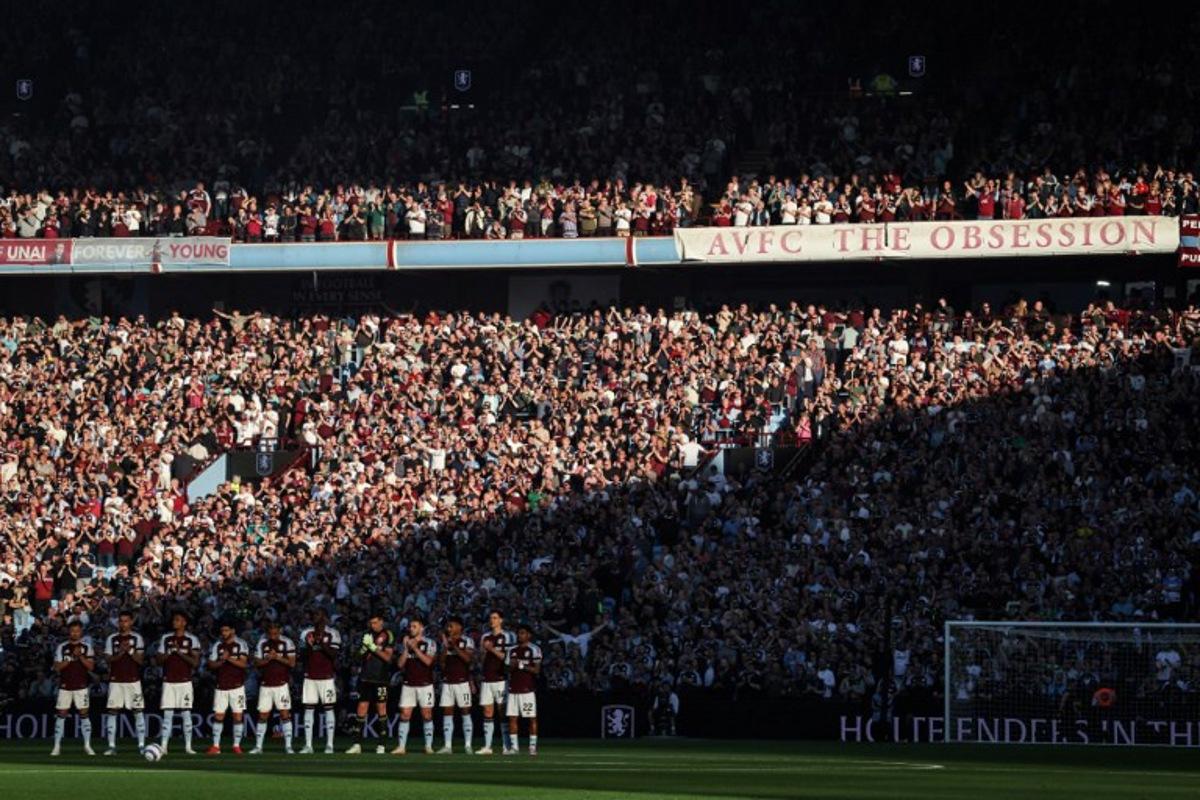 Aston Vill's team players applaud after a tribute to late former players during the English Premier League football match between Aston Villa and Tottenham Hotspur at Villa Park in Birmingham, central England on May 16, 2025. Darren Staples / AFP